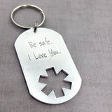 EMS dog tag keychain with Be safe I love you stamped on it.