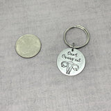Don't Ovary act keychain, Hysterectomy gift next to quarter for size comparison