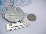 Personalized Hand Stamped Elf Christmas Ornament, size comparison to a quarter