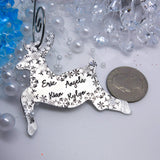 reindeer Christmas ornament next to a quarter for size