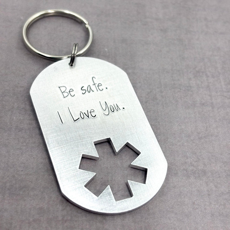 EMS dog tag keychain with Be safe I love you stamped on it.