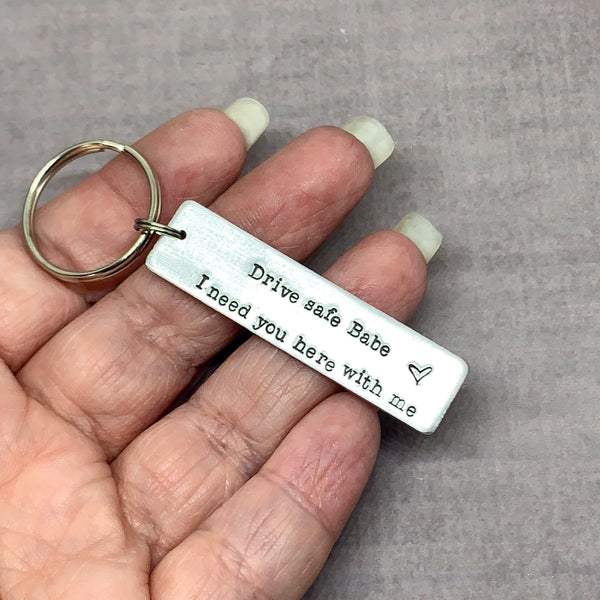 Dive Safe keychain in hand to show size