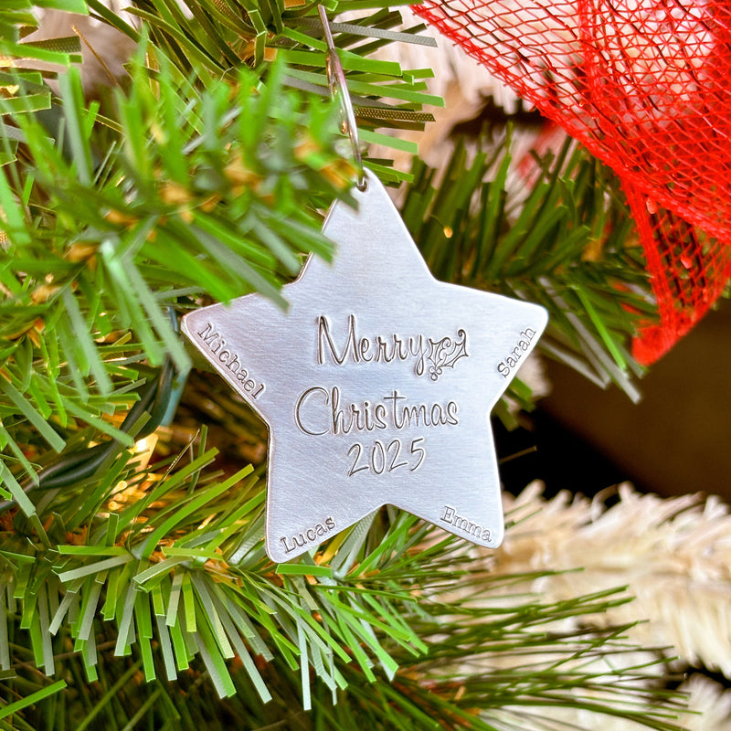 Star-shaped Christmas ornament with 'Merry Christmas 2025' text on a tree.