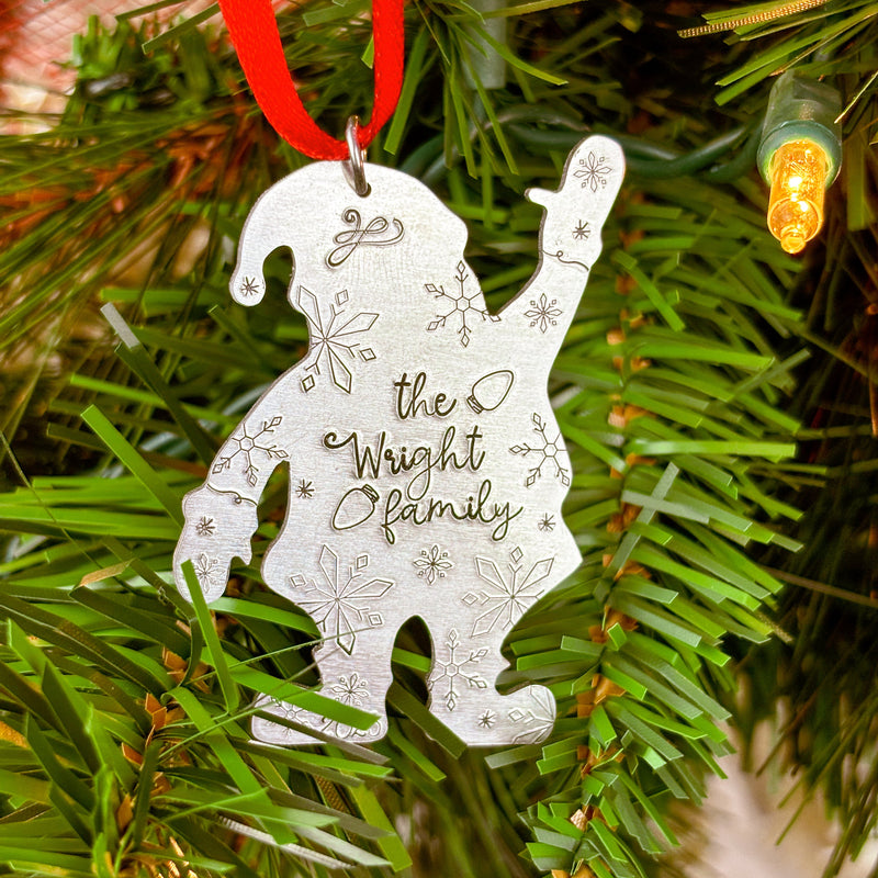 Decorative ornament with custom " Family' text on a Christmas tree.
