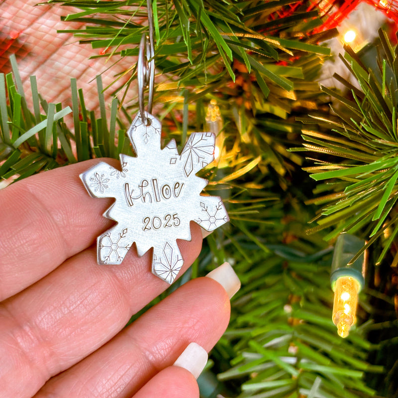 Small Personalized Snowflake Name Ornament in hand to show size