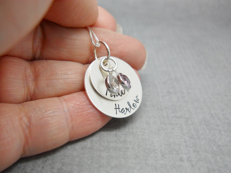 Double Stacked Sterling Silver Personalized Mom Necklace with Kids Names, held in hand