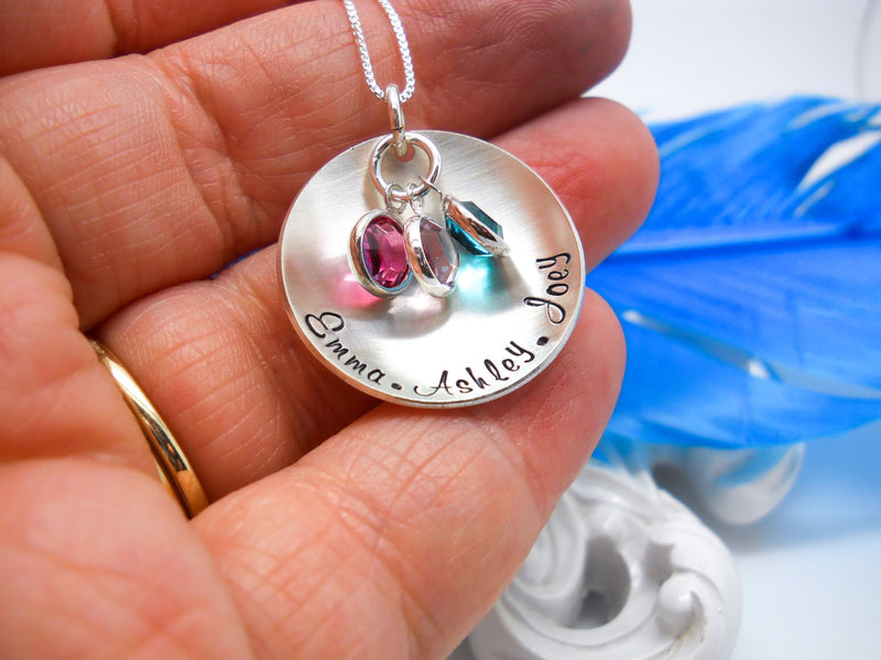 Sterling Silver Cupped Mothers Necklace With Kids Names, held in hand